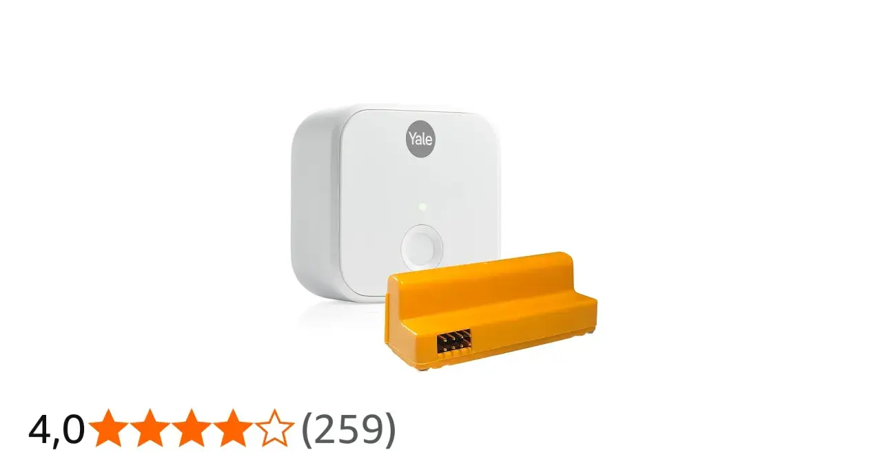 Vit Yale Access Module v2n och en orange adapter.