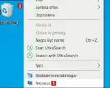 Här är en skärmdump av en dator där man kan se en ikon för "Papperskorg" och en meny. Var hittar jag papperskorgen? Den är markerad med siffran 1.