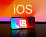 iPhone med iOS 18-ikonen. Kanske dags att byta namn på iPhone för att spegla den nya versionen?