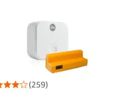 Vit Yale Access Module v2n och en orange adapter.
