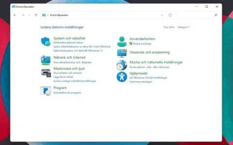 Windows 11 kontrollpanelen visar inställningar för system, nätverk, hårdvara, program, användarkonton, utseende, tid och hjälpmedel.