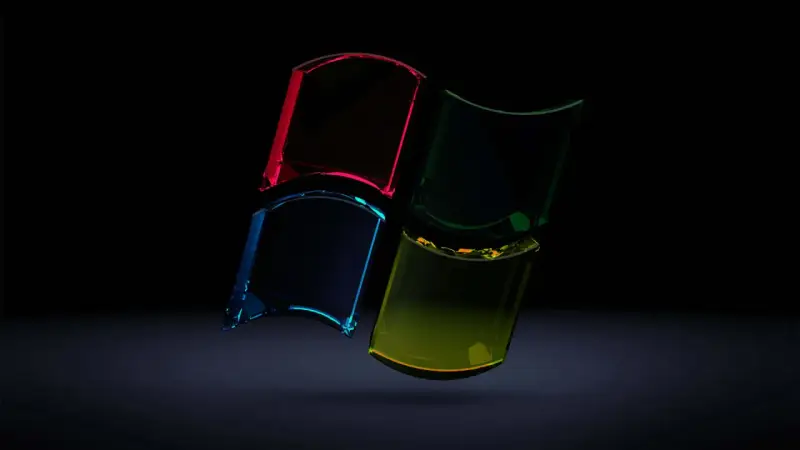 Snygga bakgrundsbilder dator: Fyrdelat Windows-logotyp i glas med lysande färger mot mörk bakgrund.
